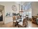 Bright dining room with glass table and wicker chairs, features a pass-through to the kitchen at 3105 Sandleheath # 1, Sarasota, FL 34235