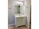 Bright bathroom with vanity, mirror, and light fixture at 320 Cardinal Rd, Venice, FL 34293