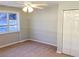 Bright bedroom with ceiling fan and double-door closet at 320 Cardinal Rd, Venice, FL 34293