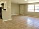 Open concept living and kitchen area with tile floors at 320 Cardinal Rd, Venice, FL 34293