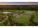 Aerial view of community amenities including playground, basketball court, and pond at 3324 Big Sky Way, Lakewood Ranch, FL 34211