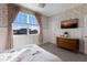 Bedroom with floral wallpaper and window view at 3324 Big Sky Way, Lakewood Ranch, FL 34211