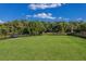 Dog park with grassy area and benches at 3324 Big Sky Way, Lakewood Ranch, FL 34211