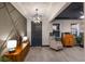 Modern entryway with mid-century furniture and geometric wall at 3324 Big Sky Way, Lakewood Ranch, FL 34211