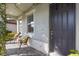 Inviting front porch with seating area and lush greenery at 3324 Big Sky Way, Lakewood Ranch, FL 34211