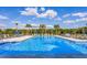 Resort-style pool with plenty of lounge chairs for relaxation at 3324 Big Sky Way, Lakewood Ranch, FL 34211