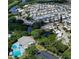 Aerial view of community with numerous homes, pool, and lush landscaping at 3333 26Th E Ave # 1155, Bradenton, FL 34208