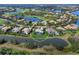 Community overview with home highlighted near lake at 3354 Founders Club Dr, Sarasota, FL 34240