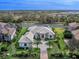 Aerial view of house and surrounding landscape at 3354 Founders Club Dr, Sarasota, FL 34240