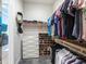 Well-organized closet with custom shelving and hanging rods at 3354 Founders Club Dr, Sarasota, FL 34240