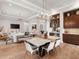 Open dining area with marble top table and modern chairs at 3354 Founders Club Dr, Sarasota, FL 34240