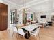 Modern dining area adjacent to kitchen and living room at 3354 Founders Club Dr, Sarasota, FL 34240