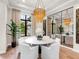 Elegant dining room with a marble table and modern chandelier at 3354 Founders Club Dr, Sarasota, FL 34240