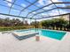 Enjoy this relaxing pool and spa area with covered patio at 3354 Founders Club Dr, Sarasota, FL 34240