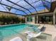 Inviting pool area with spa and covered lanai at 3354 Founders Club Dr, Sarasota, FL 34240