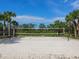 Beach volleyball court with sand and net at 3354 Founders Club Dr, Sarasota, FL 34240