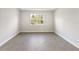 Bright and airy bedroom with large window and tile flooring at 3397 Dryden St, North Port, FL 34288