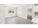 Simple dining room with tile floors and view to kitchen at 3397 Dryden St, North Port, FL 34288