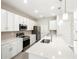 Modern kitchen with white cabinets and stainless steel appliances at 3397 Dryden St, North Port, FL 34288