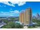 Aerial view of a yellow high-rise building in a city setting at 345 Bayshore Blvd # 706, Tampa, FL 33606