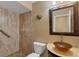 Well-appointed bathroom with a vessel sink and stone tile shower at 365 Oak Hill Way # 32, Sarasota, FL 34232