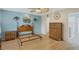 Main bedroom with wood furniture and light blue walls at 365 Oak Hill Way # 32, Sarasota, FL 34232