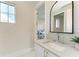 Modern bathroom with a vanity, sink, and large mirror at 3761 Founders Club Dr, Sarasota, FL 34240