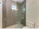 Bathroom with walk-in shower and gray tile at 3761 Founders Club Dr, Sarasota, FL 34240