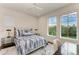 Spacious bedroom with large windows and a view at 3761 Founders Club Dr, Sarasota, FL 34240