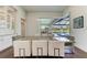 Elegant dining room with a glass top table and view of the pool at 3761 Founders Club Dr, Sarasota, FL 34240