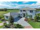 Luxury home with tile roof and a three-car garage at 3761 Founders Club Dr, Sarasota, FL 34240