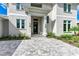 Modern front door with paver walkway and landscaping at 3761 Founders Club Dr, Sarasota, FL 34240