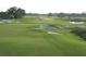 Expansive green golf course with sand traps and water features at 3761 Founders Club Dr, Sarasota, FL 34240