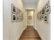 Hallway with hardwood floors and Gathering photos at 3761 Founders Club Dr, Sarasota, FL 34240