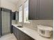 Laundry room with modern cabinetry, sink, and a drying rack at 3761 Founders Club Dr, Sarasota, FL 34240