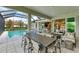 Spacious pool and patio area with seating and fire pit at 3761 Founders Club Dr, Sarasota, FL 34240