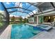 Resort-style swimming pool with spa and covered lanai at 3761 Founders Club Dr, Sarasota, FL 34240