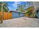 Backyard with gravel area and wooden fence at 3902 11Th W Ave, Bradenton, FL 34205