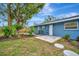 Renovated backyard with patio, landscaping, and wooden fence at 3902 11Th W Ave, Bradenton, FL 34205