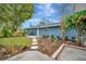 Landscaped backyard with a stone pathway and trees at 3902 11Th W Ave, Bradenton, FL 34205