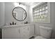 Modern bathroom with double vanity and marble countertop at 3902 11Th W Ave, Bradenton, FL 34205