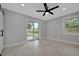 Bright bedroom with ceiling fan and sliding glass door to backyard at 3902 11Th W Ave, Bradenton, FL 34205