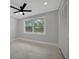 Light-filled bedroom featuring wood-look floors and a ceiling fan at 3902 11Th W Ave, Bradenton, FL 34205