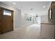 Modern entryway with wood door and light gray walls at 3902 11Th W Ave, Bradenton, FL 34205