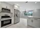 Modern kitchen with island and stainless steel appliances at 3902 11Th W Ave, Bradenton, FL 34205