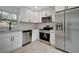 Modern kitchen with stainless steel appliances and white cabinets at 3902 11Th W Ave, Bradenton, FL 34205