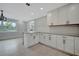 Modern kitchen with white cabinets and stainless steel appliances at 3902 11Th W Ave, Bradenton, FL 34205