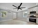 Bright living room with ceiling fan, new flooring and window at 3902 11Th W Ave, Bradenton, FL 34205