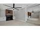 Living room with a modern fireplace and built-in shelving units at 3902 11Th W Ave, Bradenton, FL 34205