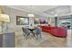 Bright dining room with glass table, gray chairs and entryway view at 4020 Cascina Way, Sarasota, FL 34238